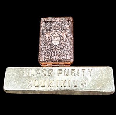 Lot 133 - An aluminium ingot (450g) and a cast metal...