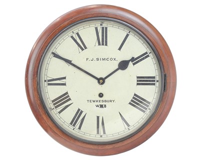 Lot 799 - A spring driven circular mahogany wall clock.