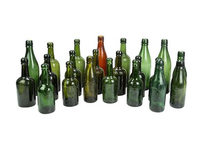 Lot 630 - A collection of local interest glass bottles.