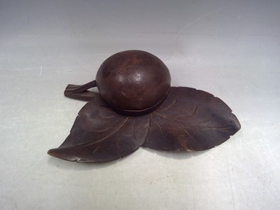 Lot 17 - A Carved Wood Inkwell with a Glass Well. The...