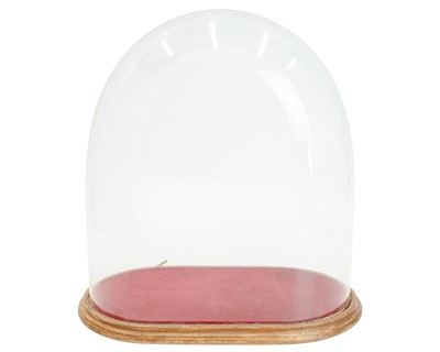 Lot 44 - A large glass dome, height 43cm.