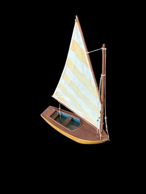 Lot 156 - A model wooden sailing boat, 33cm long.