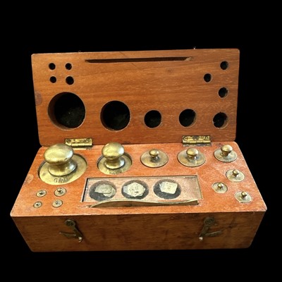 Lot 158 - A set of Georgian brass chemistry weights...