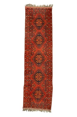Lot 492 - An Afghan wool carpet runner.