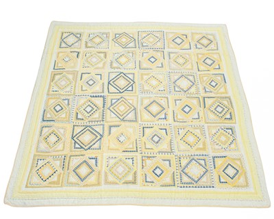 Lot 538 - A yellow patchwork quilt.