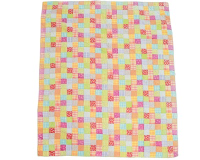 Lot 552 - A colourful patchwork quilt.