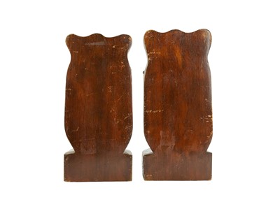 Lot 29 - A pair of Eastern hardwood bookends, carved with snarling tigers' heads.
