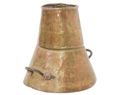 Lot 86 - An Eastern copper vessel with twin wrought iron handles.