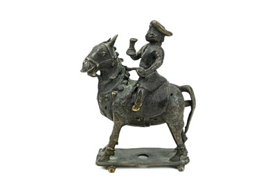 Lot 362 - An Indian bronze figure of a man on horseback.