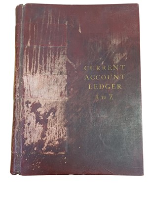 Lot 77 - A large late 19th/early 20th century maroon leather bound 'Current Account Ledger'.