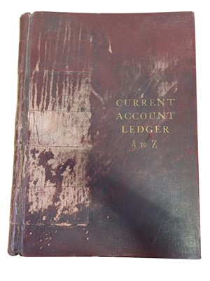Lot 77 - A large late 19th/early 20th century maroon leather bound 'Current Account Ledger'.