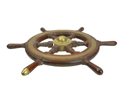 Lot 58 - A teak and brass mounted ship's wheel.