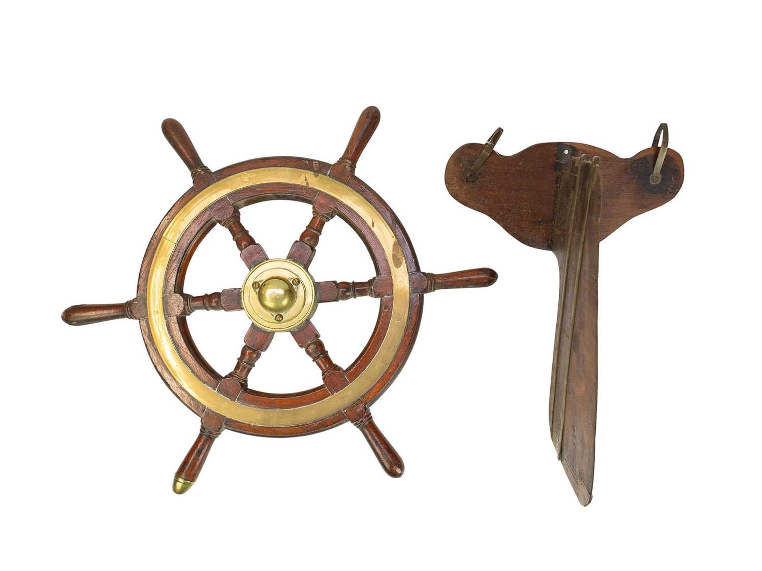 Lot 58 - A teak and brass mounted ship's wheel.