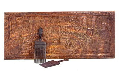 Lot 151 - An African carved wood panel with figural decoration.
