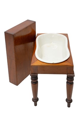 Lot 883 - A 19th century mahogany bidet with turned legs.