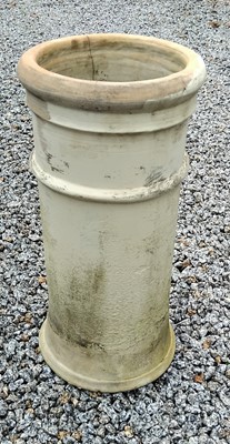 Lot 766 - A white-painted terracotta rib-banded chimney pot, of cylindrical form.