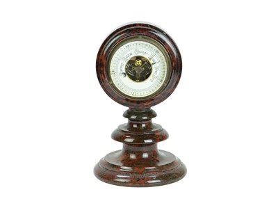 Lot 27 - A Cornish red serpentine cased aneroid barometer.