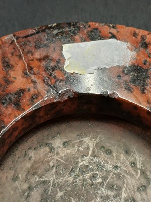 Lot 27 - A Cornish red serpentine cased aneroid barometer.