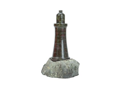 Lot 66 - A collection of nine Cornish serpentine turned models of lighthouses.