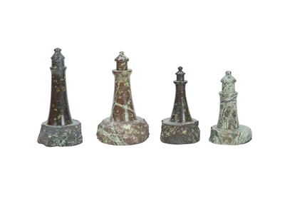 Lot 66 - A collection of nine Cornish serpentine turned models of lighthouses.