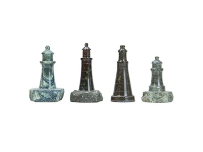 Lot 66 - A collection of nine Cornish serpentine turned models of lighthouses.