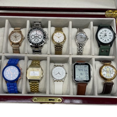Lot 31 - A glazed 12 section wrist watch case with key,...