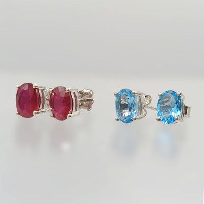 Lot 99 - Two pairs of silver earrings, set with ruby and topaz.