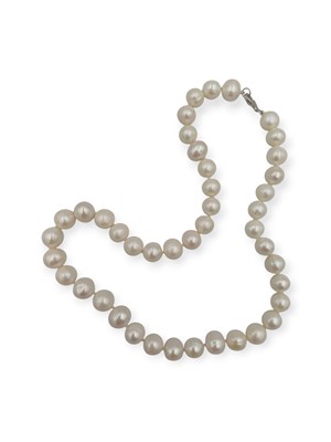 Lot 105 - A white cultured pearl necklace with a silver clasp.