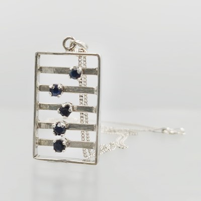 Lot 107 - A silver and sapphire interactive pendant necklace.