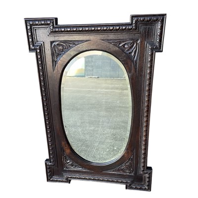 Lot 78 - An Antique Carved Oak bevelled-edge Mirror. 63...