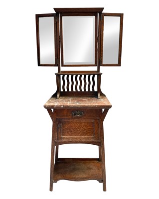 Lot 960 - An Arts and Crafts oak dressing stand.