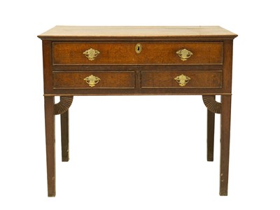 Lot 708 - A George III oak side table.
