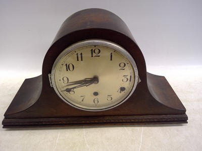 Lot 115 - An Oak Napoleon Hat Mantle Clock. The Cock...