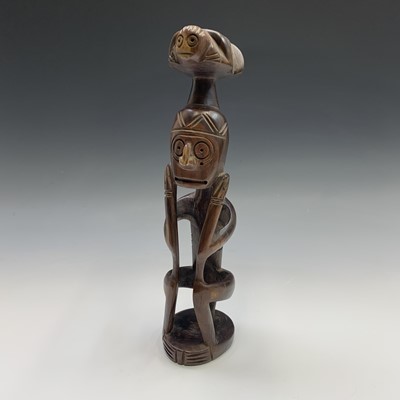 Lot 157 - An ethnic carved wood figure. Height 40cm.