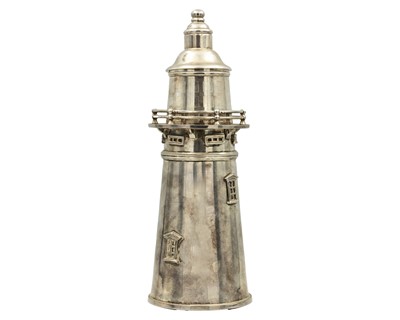 Lot 144 - A modern silver-plated novelty cocktail shaker in the form of a lighthouse.