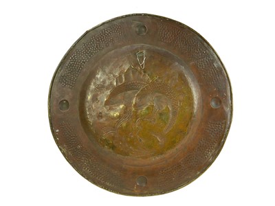 Lot 87 - An Arts and Crafts circular brass charger.