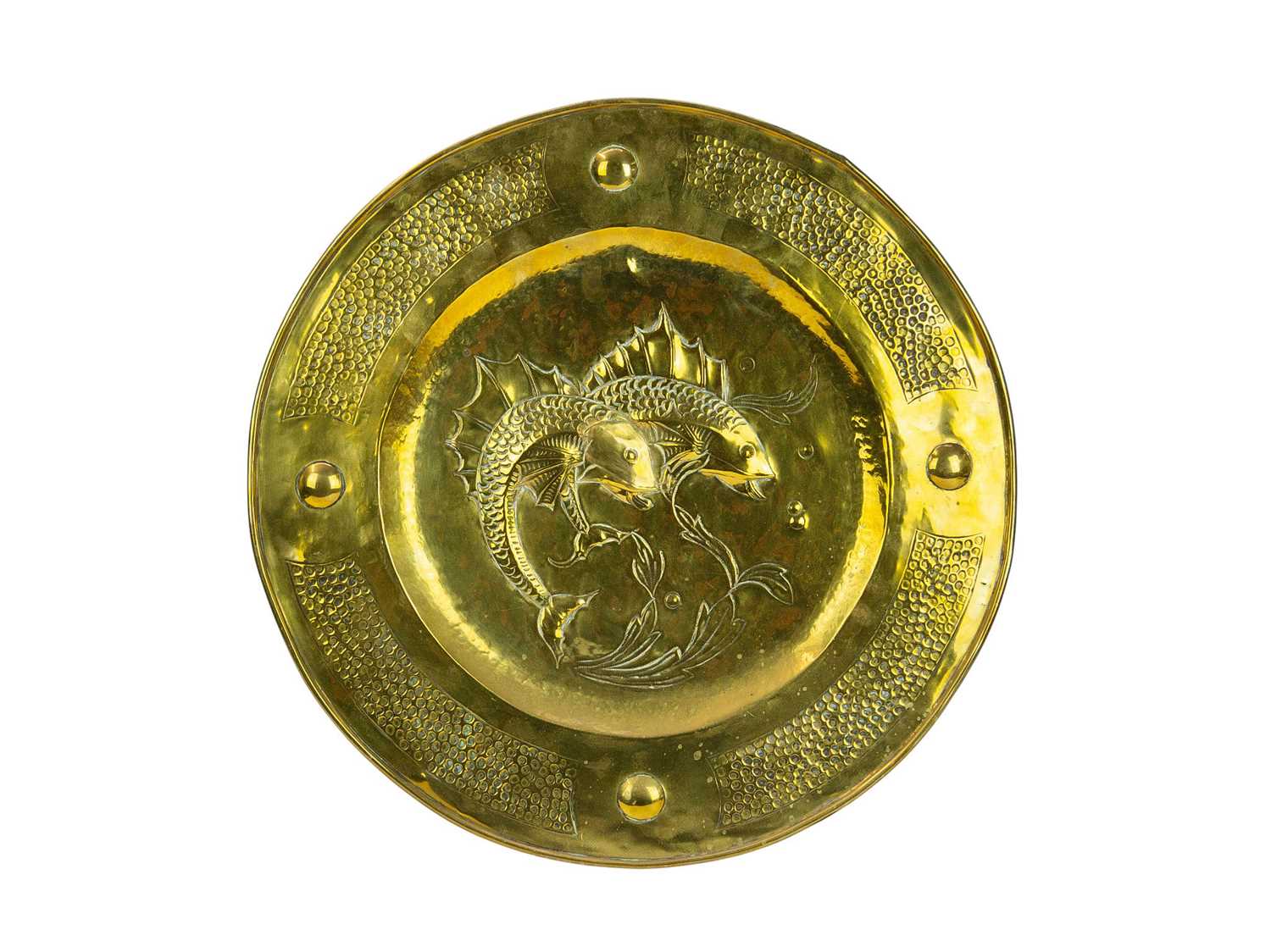 Lot 87 - An Arts and Crafts circular brass charger.