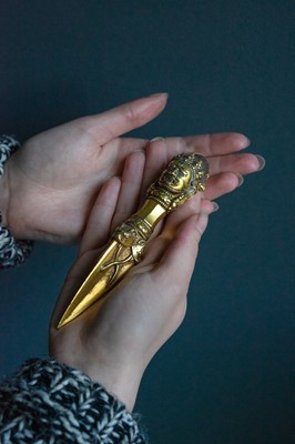 Lot 360 - A Tibetan gilt phurba.