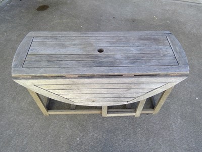 Lot 15 - A Hardwood Folding Garden Table. The Table is...