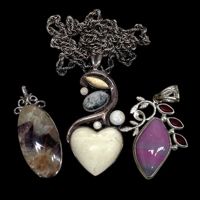 Lot 145 - Three 925-marked silver and stone set pendants...