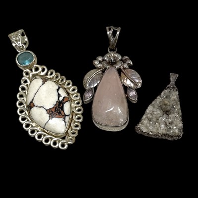 Lot 149 - Three silver and stone-set pendants.