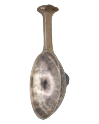 Lot 9 - A E JONES - An Arts & Crafts silver caddy spoon.
