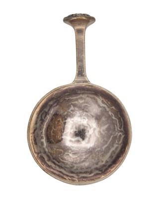 Lot 9 - A E JONES - An Arts & Crafts silver caddy spoon.