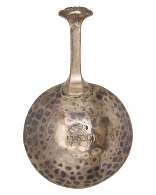 Lot 9 - A E JONES - An Arts & Crafts silver caddy spoon.