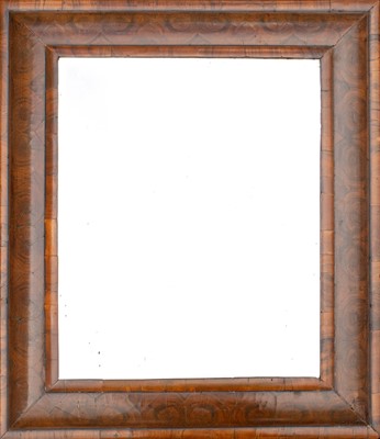 Lot 509 - An oyster veneered cushion moulded wall mirror.
