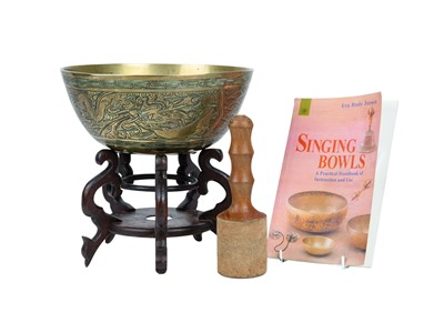 Lot 414 - A Chinese/Tibetan brass singing bowl.