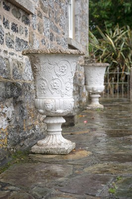 Lot 745 - A pair of reconstituted stone garden urns.