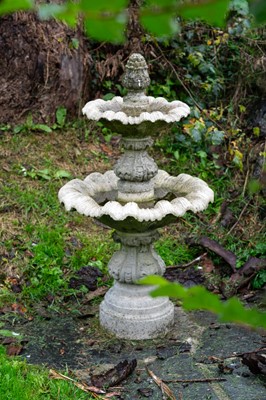 Lot 759 - A reconstituted stone two-tier fountain.