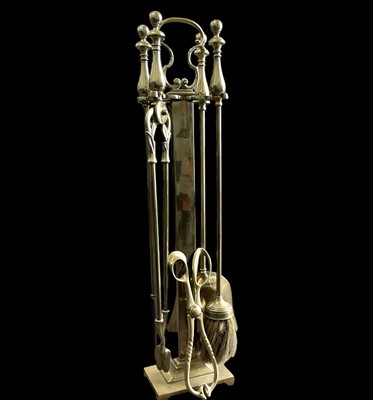 Lot 137 - A brass fireside companion set and a pair of...