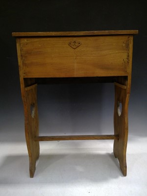 Lot 16 - A rustic elm sewing box with carved heart...